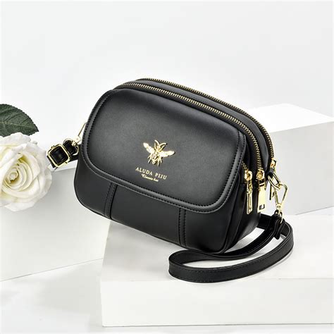 purse with bee emblem